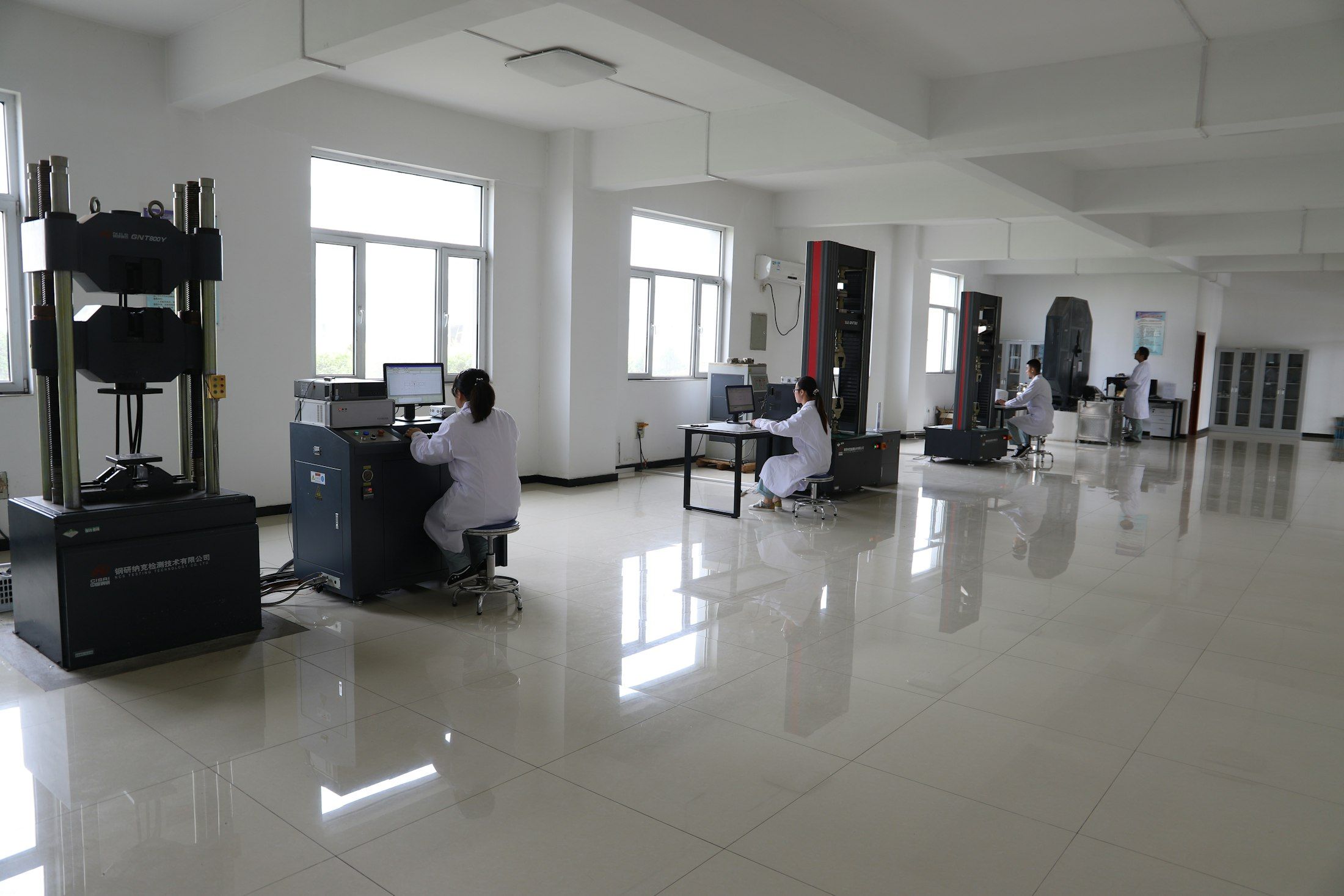 Technicians in a materials testing laboratory