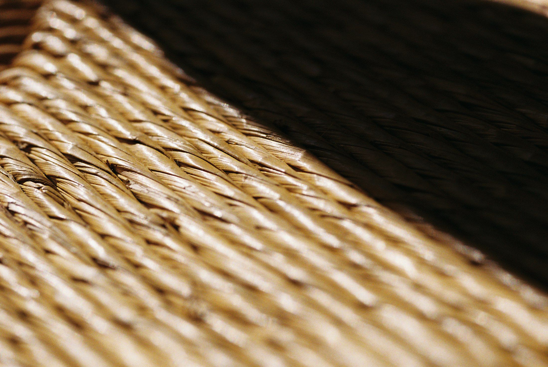 Close-up of a natural-fibre weave in warm light