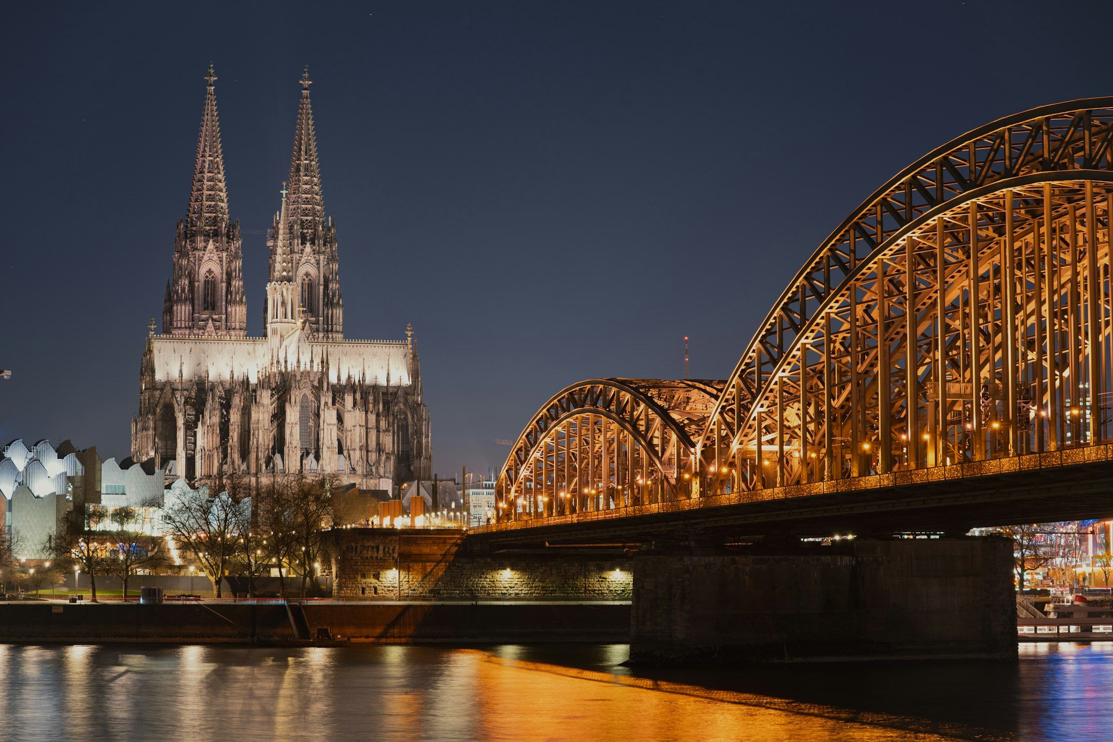 The Hohenzollern Bridge and Cologne Cathedral on the Rhine at night